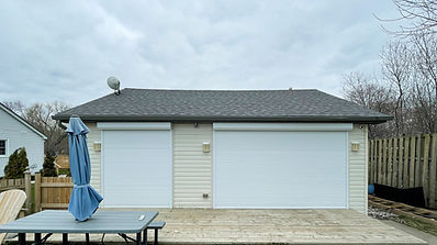 Seasonal cottage on Lake Erie with exterior roll shutters on a large patio door and twelve foot opening less than one hundred feet from the waterfront