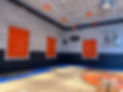 Three roll shutters closed over gymnasium windows protecting glass from ball impact