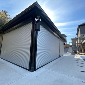 Outdoor living room enclosed with a custom screen or shutter solution