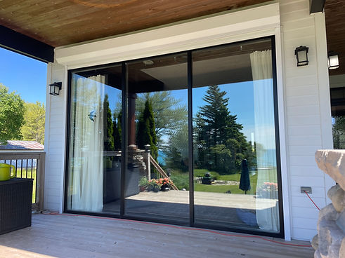 Exterior residential roll shutter installed on house window in Ontario