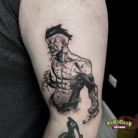 Black and grey tattoo of Invincible on a bicep.