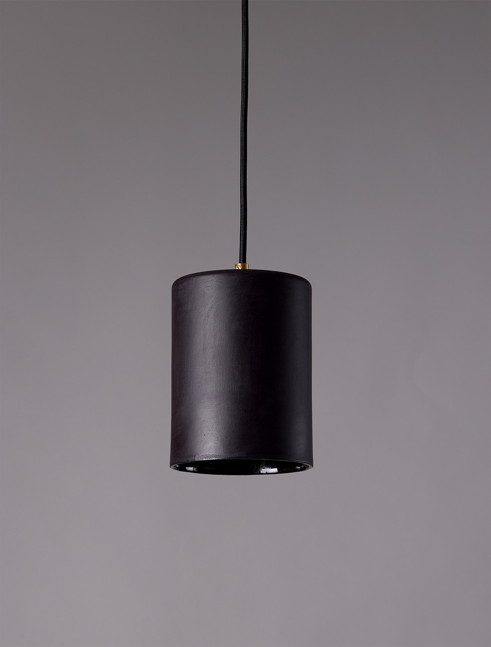 Moro black ceramic pendant light with cylindrical form