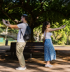 Small business owners participating in a smartphone photography workshop, creating authentic marketing images and learning vi