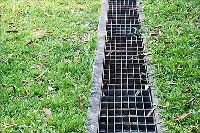 depositphotos_87588498-stock-photo-iron-grate-of-water-drain_edited.jpg