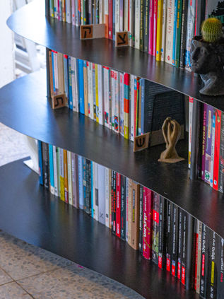 curvy modern metal library design, custom metal design in black