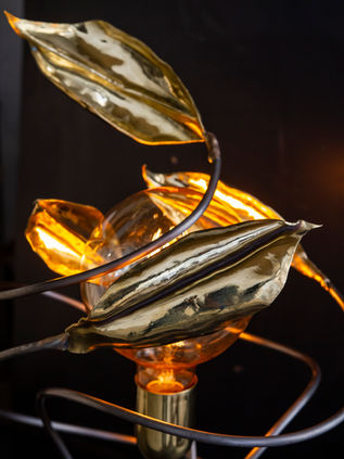 a spiral brass leaf lamp by Niv Shafran