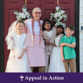 Smiling woman and four children in formal clothes stand on a porch with floral wreaths; banner reads Appeal in Action.