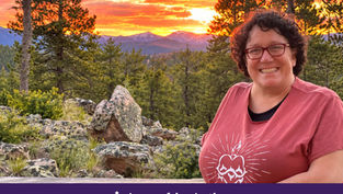 Smiling woman in red glasses and shirt stands by rocky pines at sunset; purple banner reads Appeal in Action.