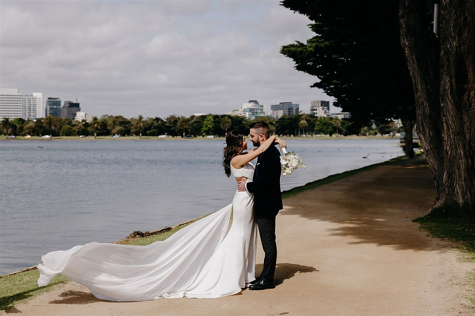 Jessica and Ric by Albert Park lake in wedding attire