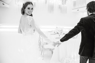 Bride and groom holding hands