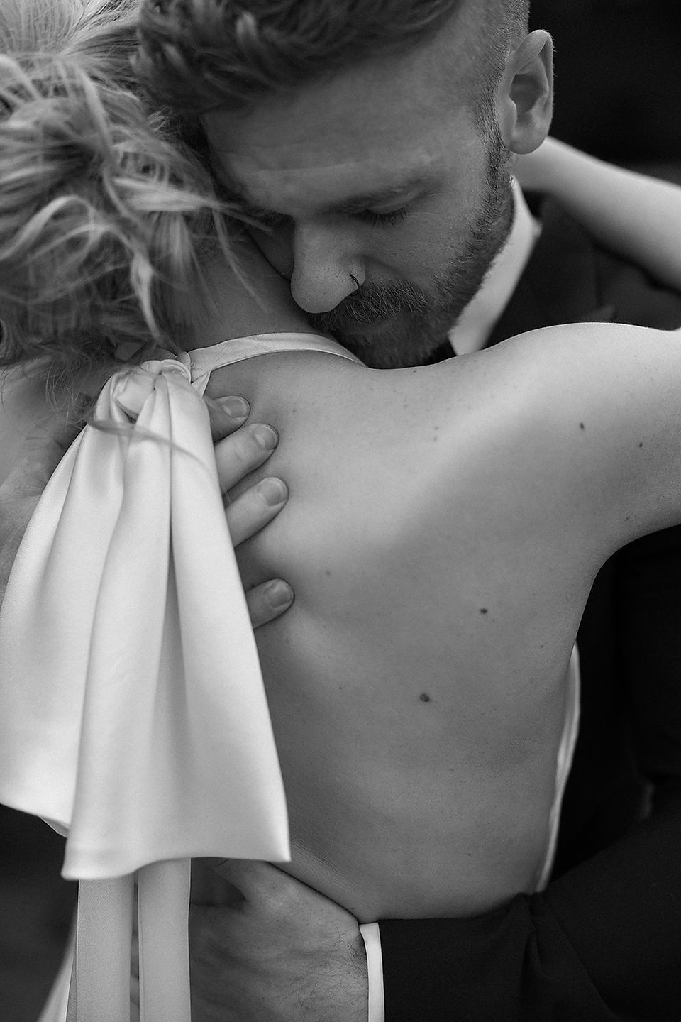 bride and groom hugging
