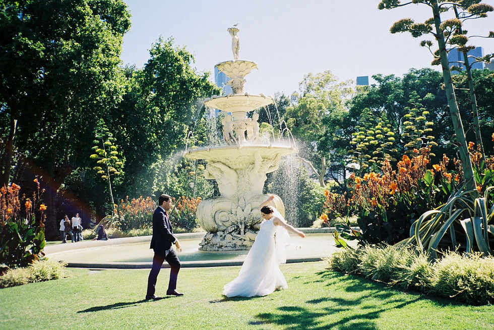 Bride and groom beside the Carlton Gardens fountain in Melbourne