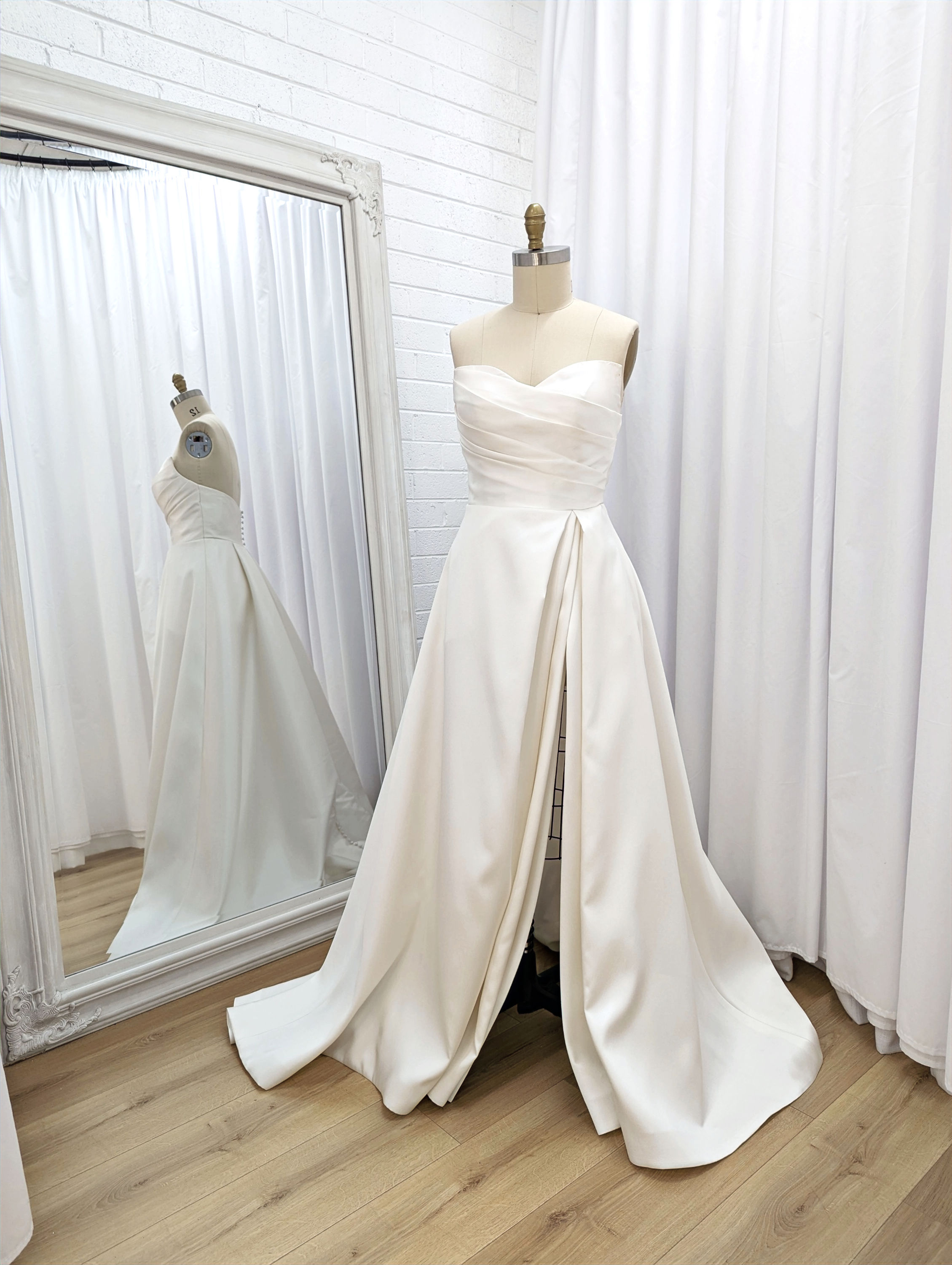 Calssic Aline wedding dress with leg split, photographed on mannequin, front view