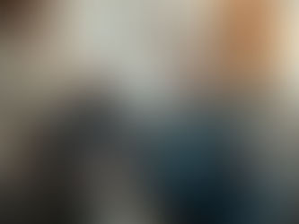 Middle aged couple sitting in their livingroom.