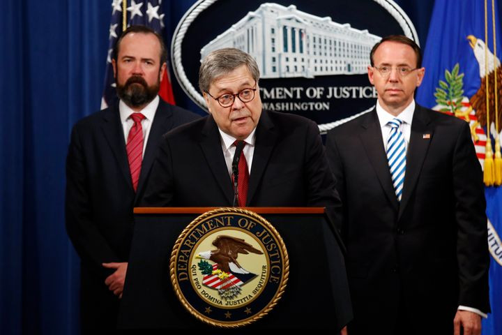 Attorney General William Barr speaks alongside Deputy Attorney General Rod Rosenstein, right, and Deputy Attorney General Ed