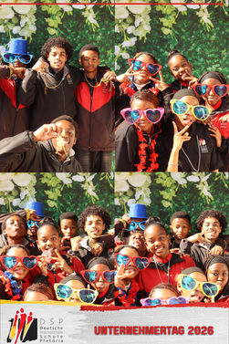 Students enjoying a fun school event DSLR photo booth with themed props by Horizon360Booth.