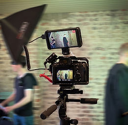 Camera filming BTS of theatre promotional trailer