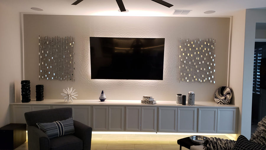 backlit TV and floating cabinets with led lighting 