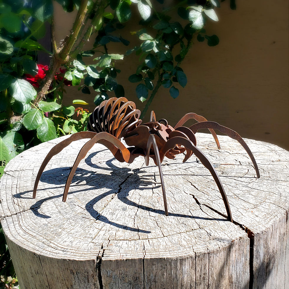 Rusted metal spider sculpture handcrafted in the USA by Ironstone Steel – 3D welded steel art with rich rusted patina