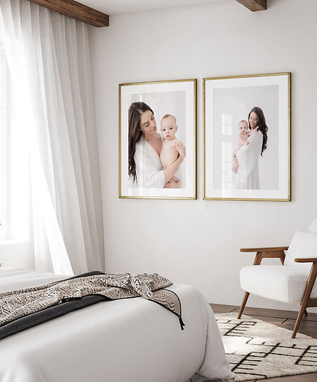Bedroom with framed photos of mother and child.