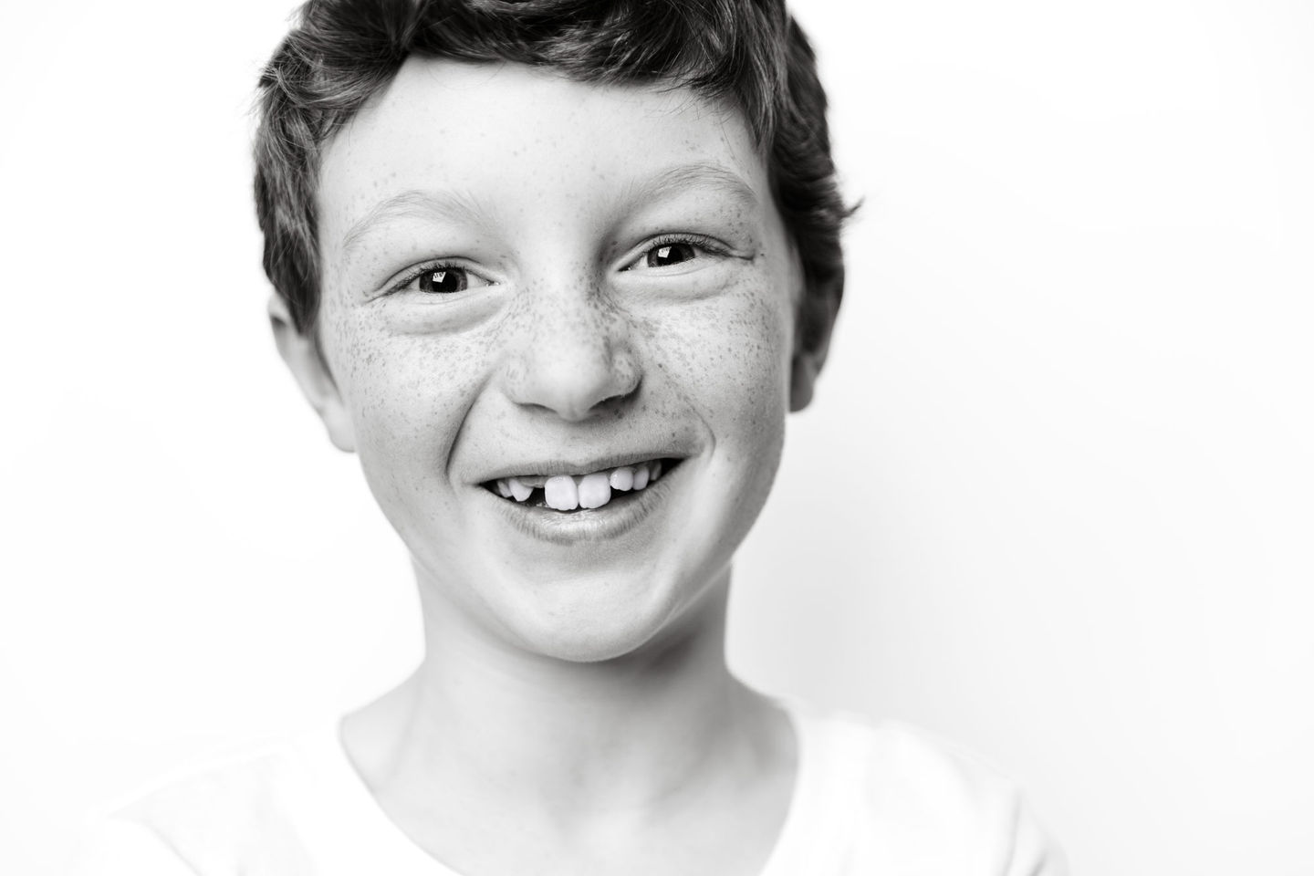 Black and white of boy with freckles