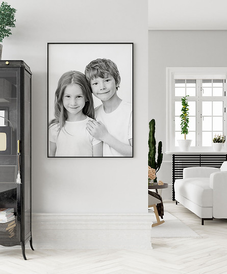 Framed photograph on wall of two siblings