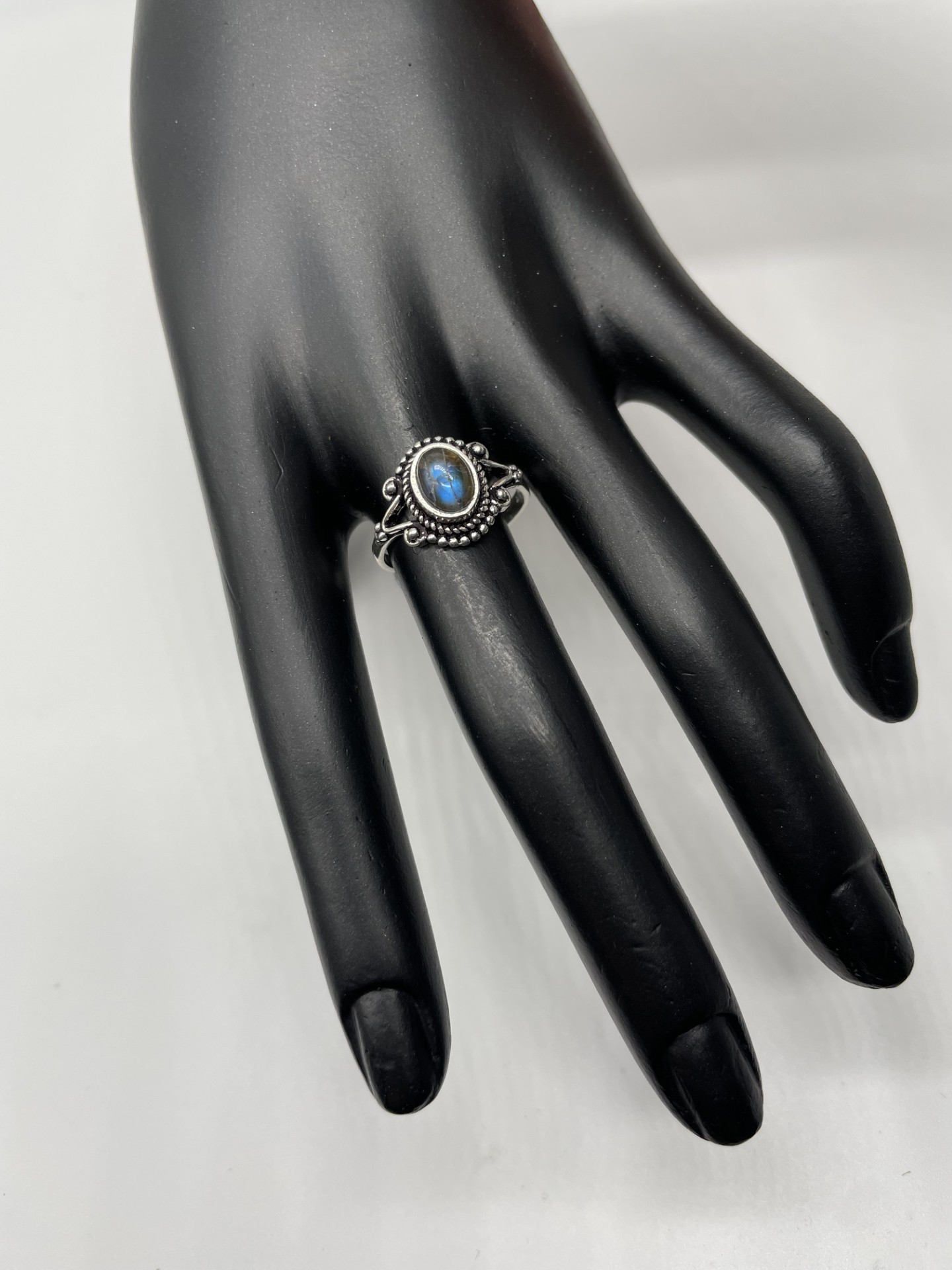 Ring is smaller design style with vintage setting and a Labradorite feature gemstone with blue flash