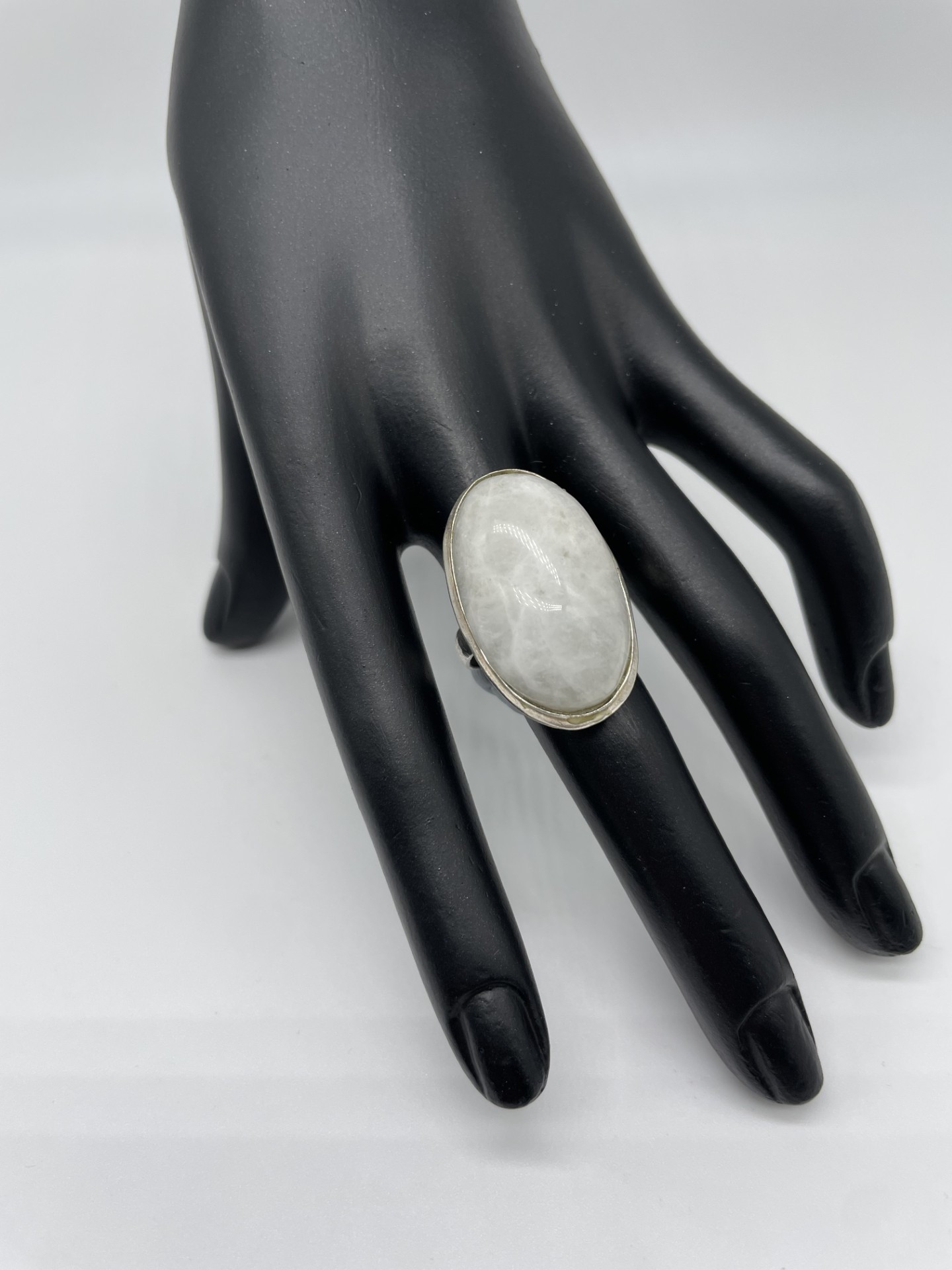 This ring is very modern and stylish with a single large Rainbow Moonstone in a simple setting. You can literally wear this with anything.