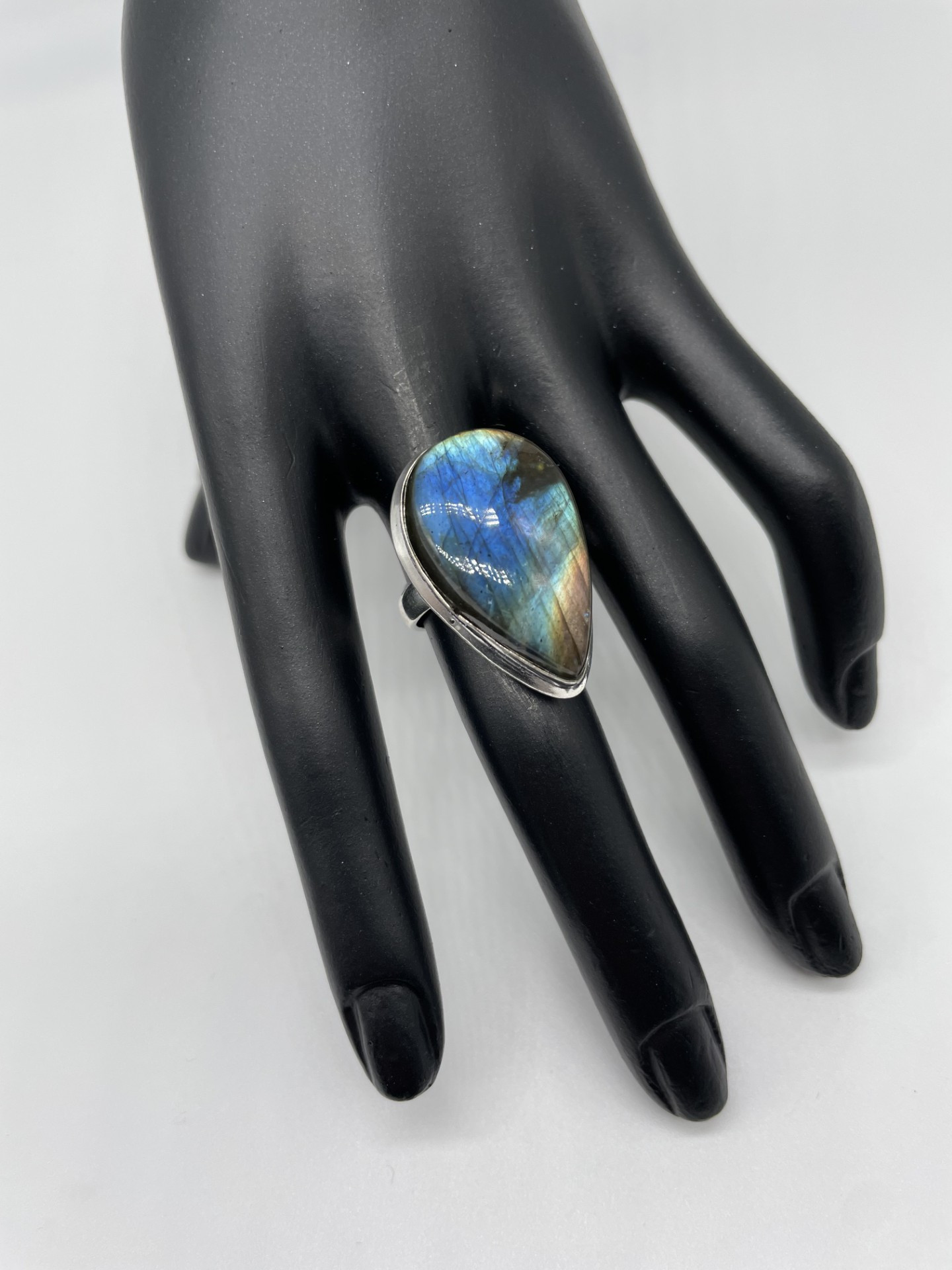 Labradorite ring with stunning flashes in teardrop shape. This ring is in a simple setting but creates an impact as you turn your hand and the flashes are visible.