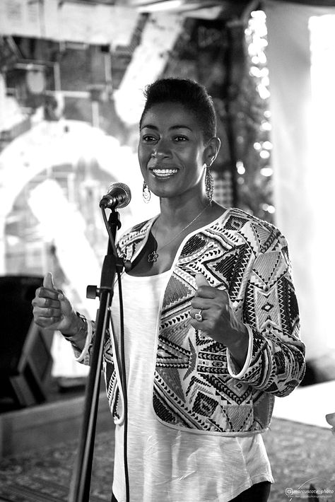 Ayana speaking at an event.