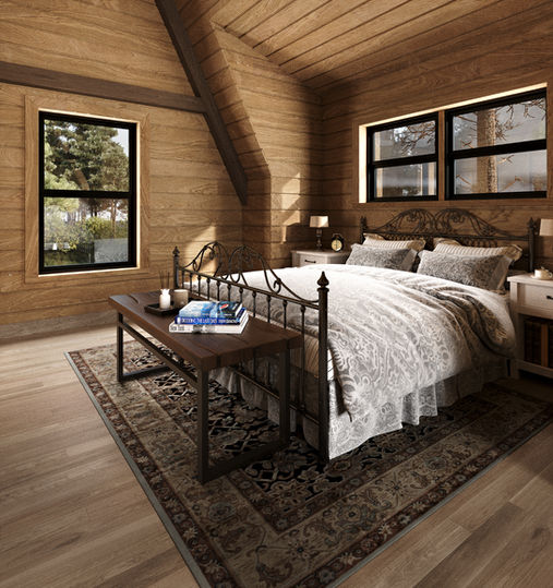 Rustic timber bedroom with wrought-iron bedframe, vintage decor, and large windows overlooking forest landscape.