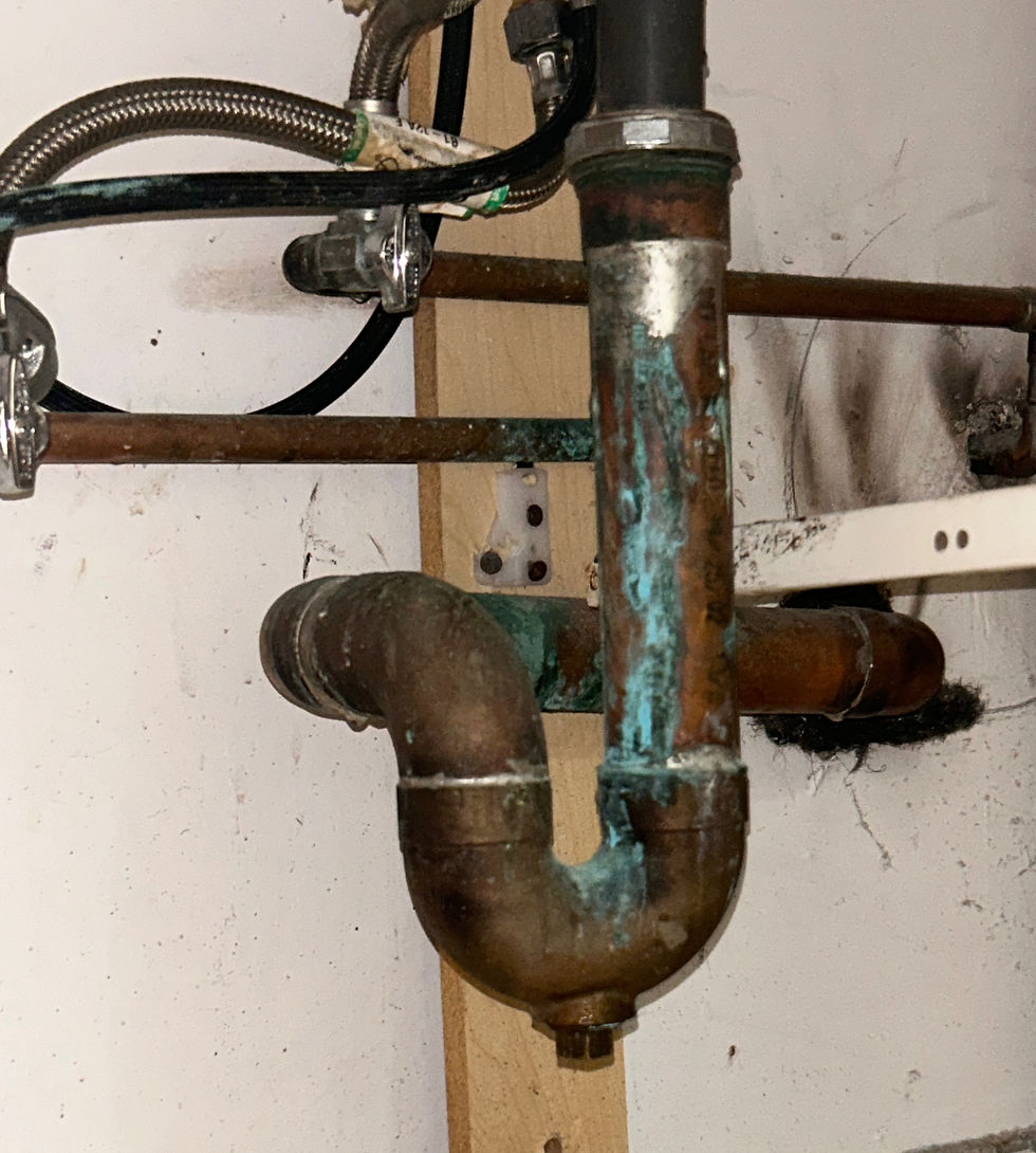 Close-up view of leaking pipe with water dripping