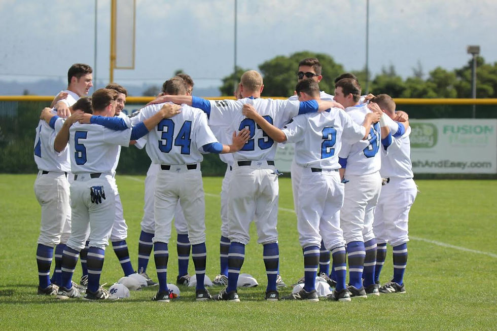 Monte Vista baseball players praying before game.