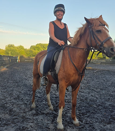 Confident rider enjoying a horse riding lesson