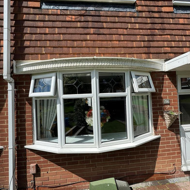 Bay window pressure washed brickwork