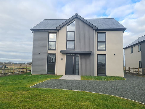 Modern suburban house with gray paneling and white walls