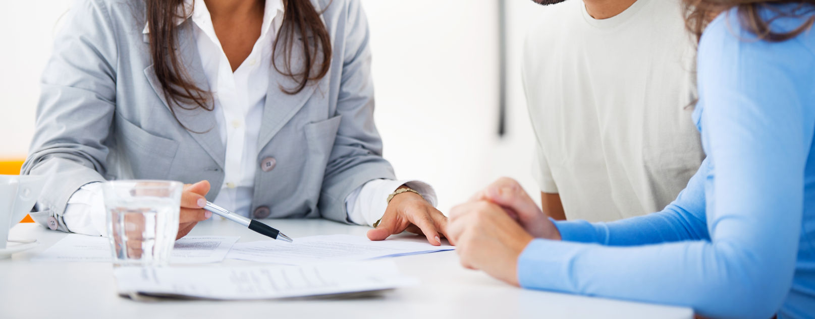 Financial advisor discussing investment plans with young couple