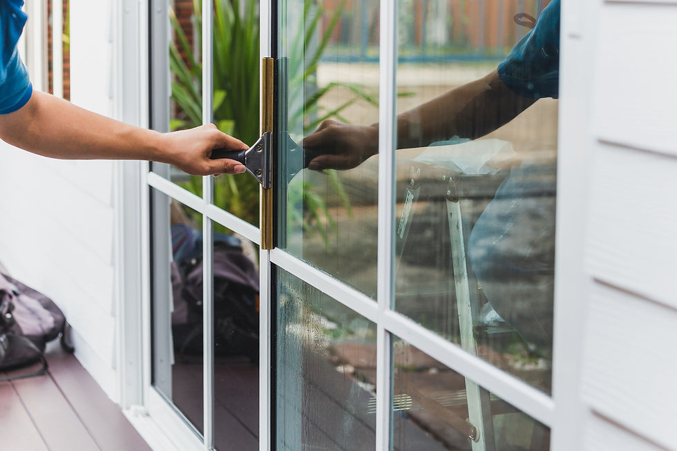 Person cleaning a window