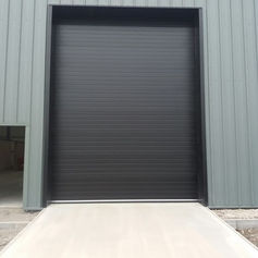 Large industrial roller shutter door on metal clad building