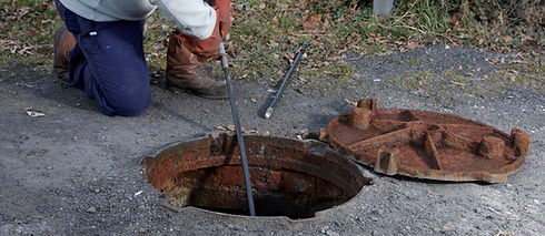 Man clearing the drains