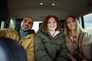 A group of smiling friends traveling together