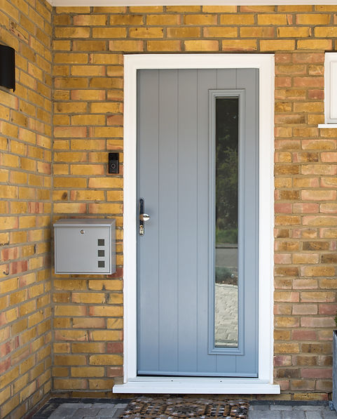 A general view of an entrance with a grey front door