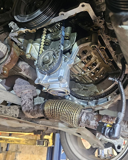 Photo of vehicle engine bay components during mechanical repair work