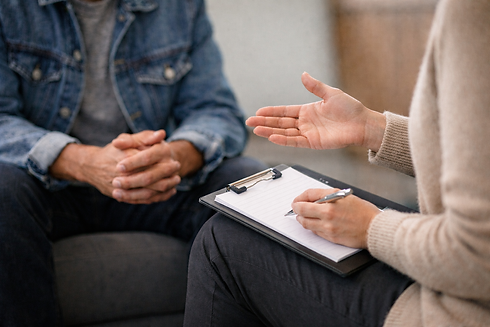 A counselor and client in discussion, with a focus on their hands