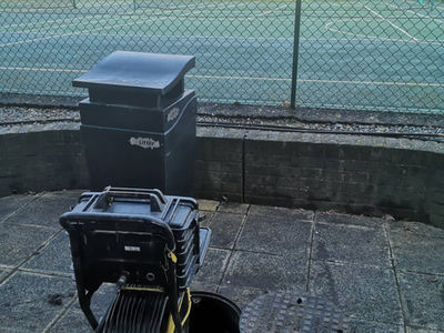 A portable drainage monitor casing showing a clear internal view of a pipe structure
