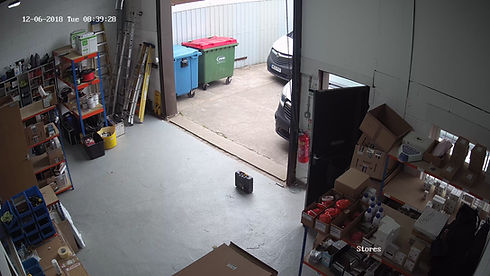 A storage area with shelves of boxes and supplies