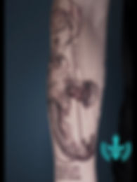 Detailed arm tattoo with 