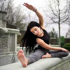 yogi stretches outdoors at a park