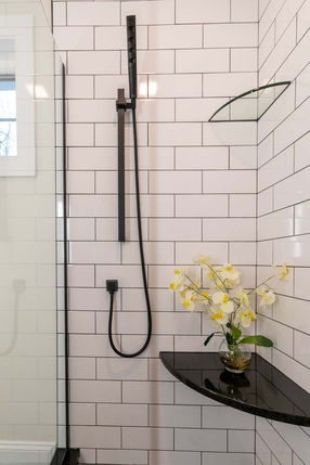 Curbless shower with grab bar, subway tile, curbless entry