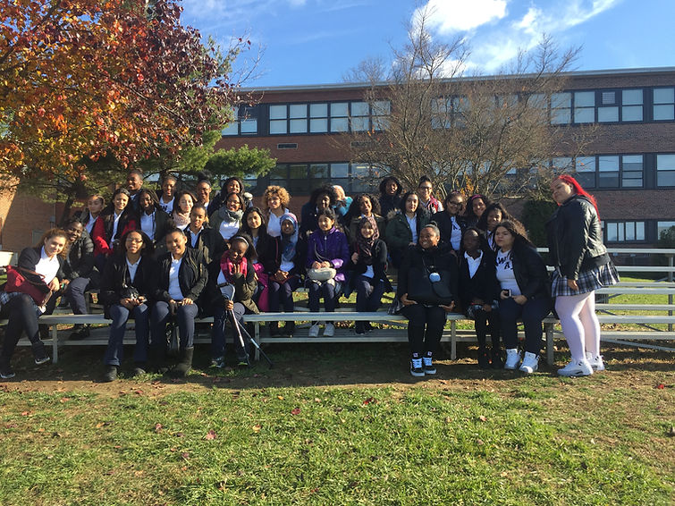 Class of 2018 posing outside of Mercy College on a junior class college trip.